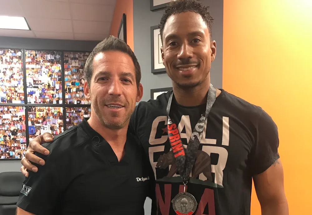 Dr. Ryan Alter with an athlete patient at Alter Chiropractic