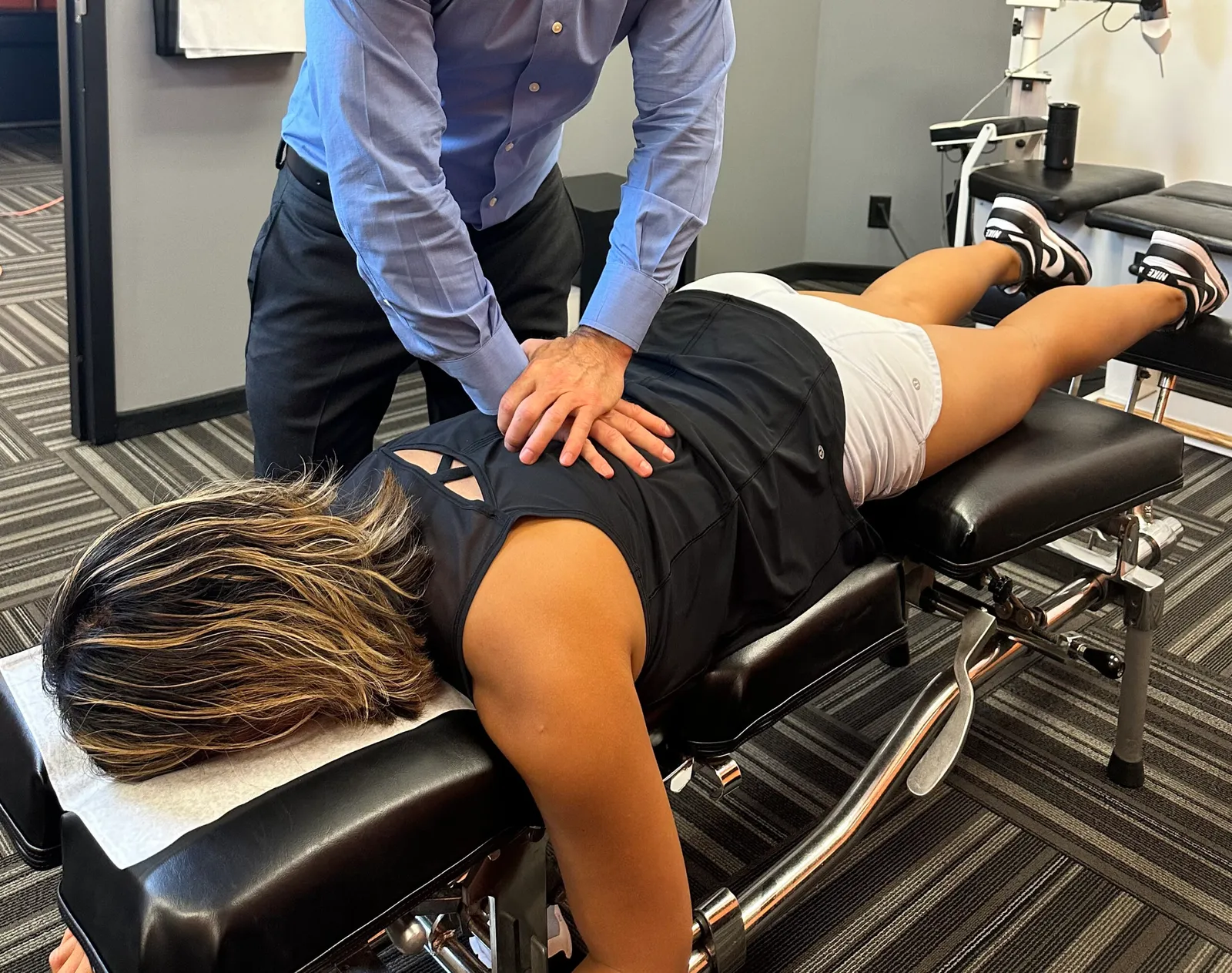 Dr. Ryan Alter performing a spinal adjustment