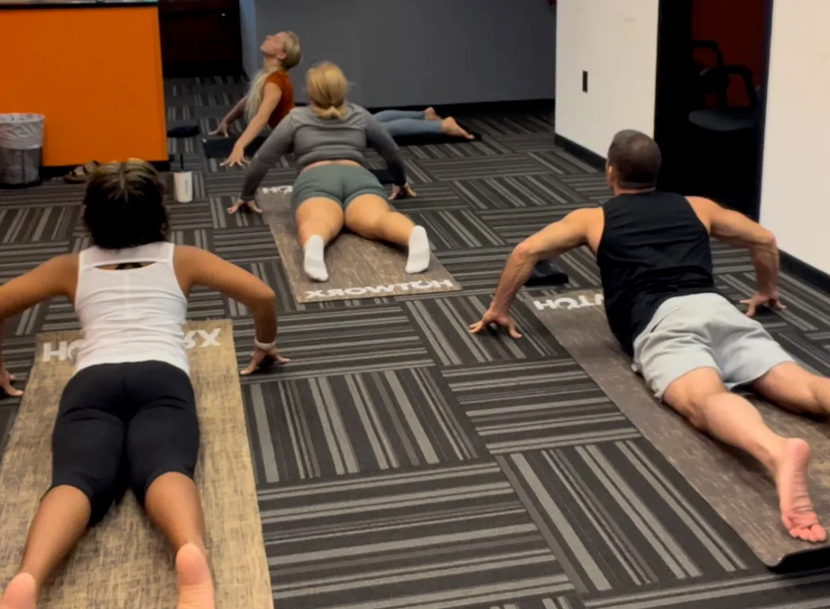 patients doing press-up stretches on exercise mats