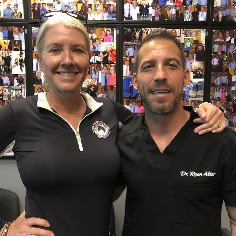 dr ryan alter with a lovely woman chiropractor patient