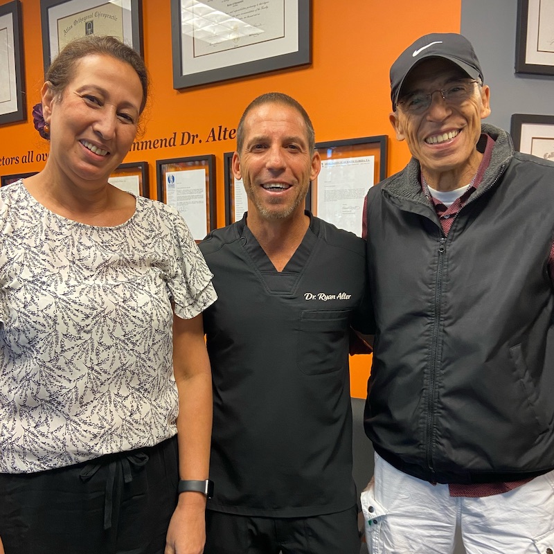 dr ryan alter, with chiropractic care patient