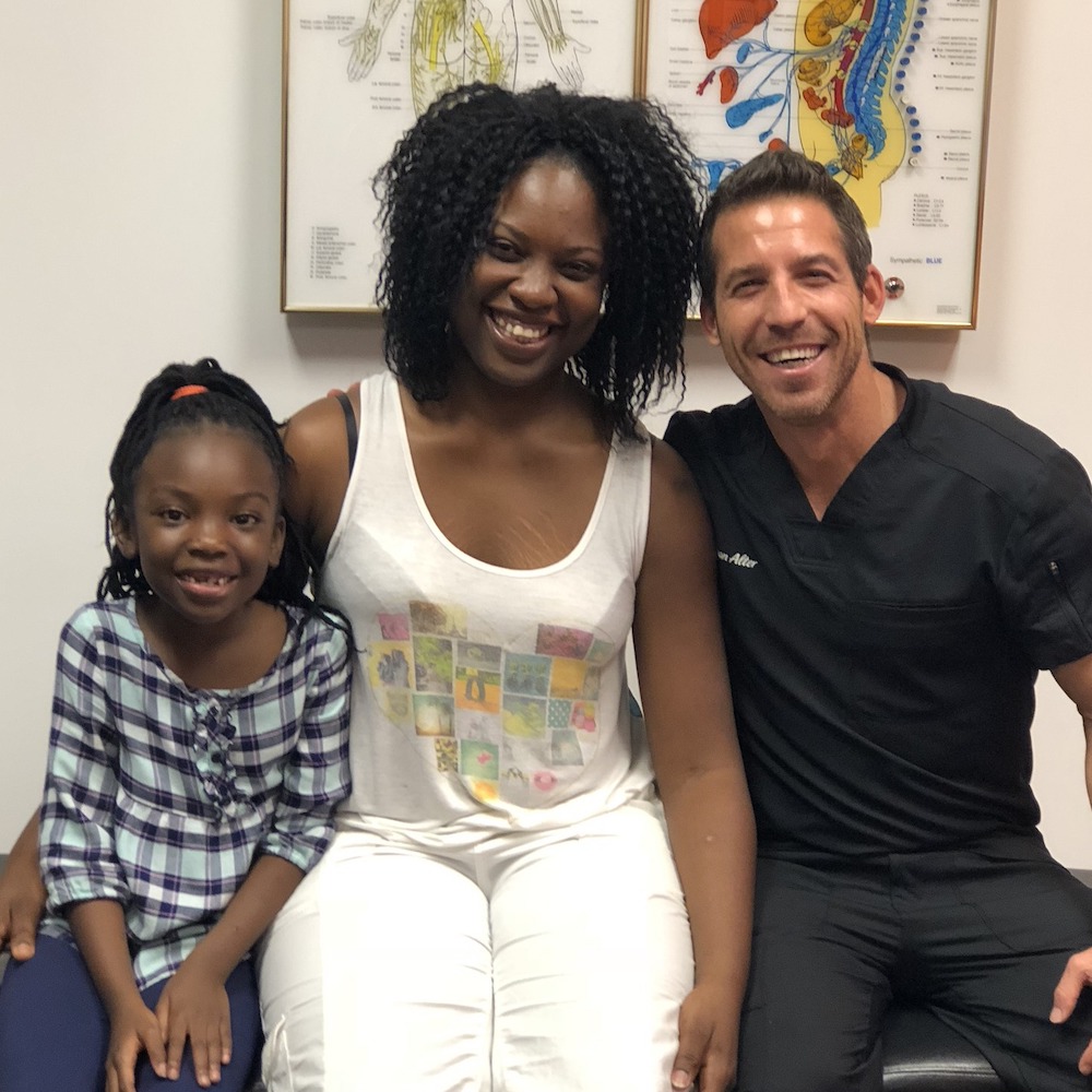 Virginie-Destine and daughter with dr ryan alter