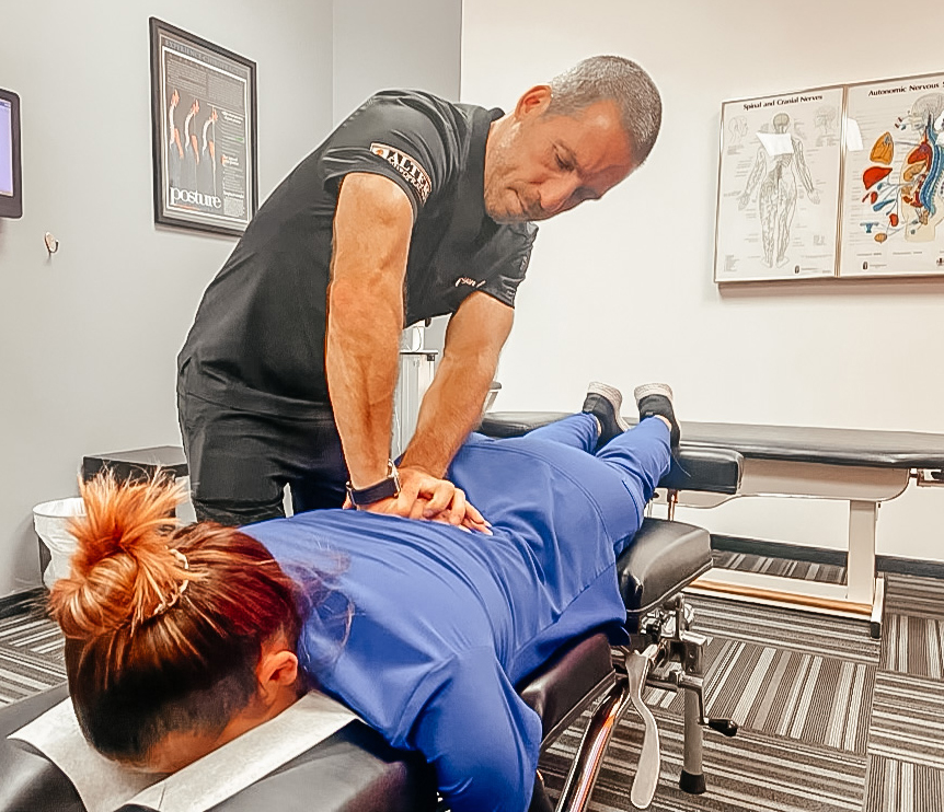 dr ryan alter doing spinal adjustment due to poor posture