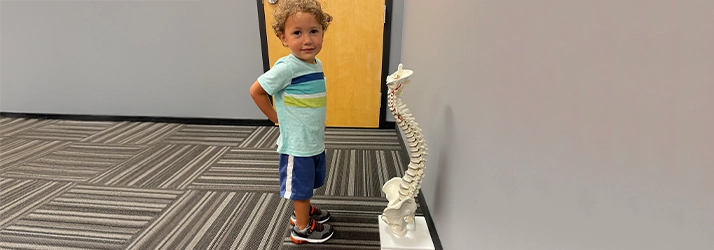 Chiropractic Delray Beach FL Little Kid With Spine Diagram