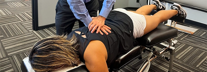 Chiropractic Delray Beach FL Woman Receiving Posture Adjustment