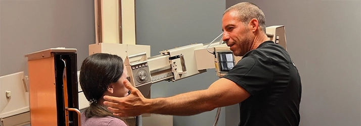 Chiropractor Delray Beach FL Ryan Alter Using X-Ray Machine On Patient