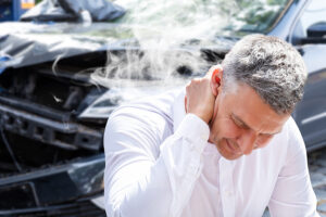 man suffering whiplash